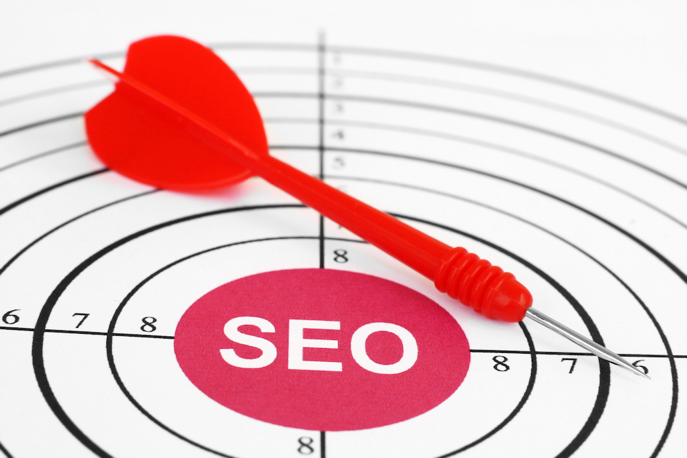 Using keywords to help with Pinterest SEO. Red target aimed at an SEO bullseye. https://webstrategies.com/