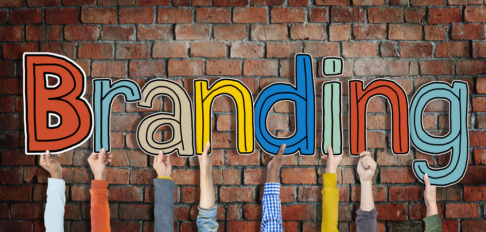 Multiethnic Group of Hands Holding Word Branding